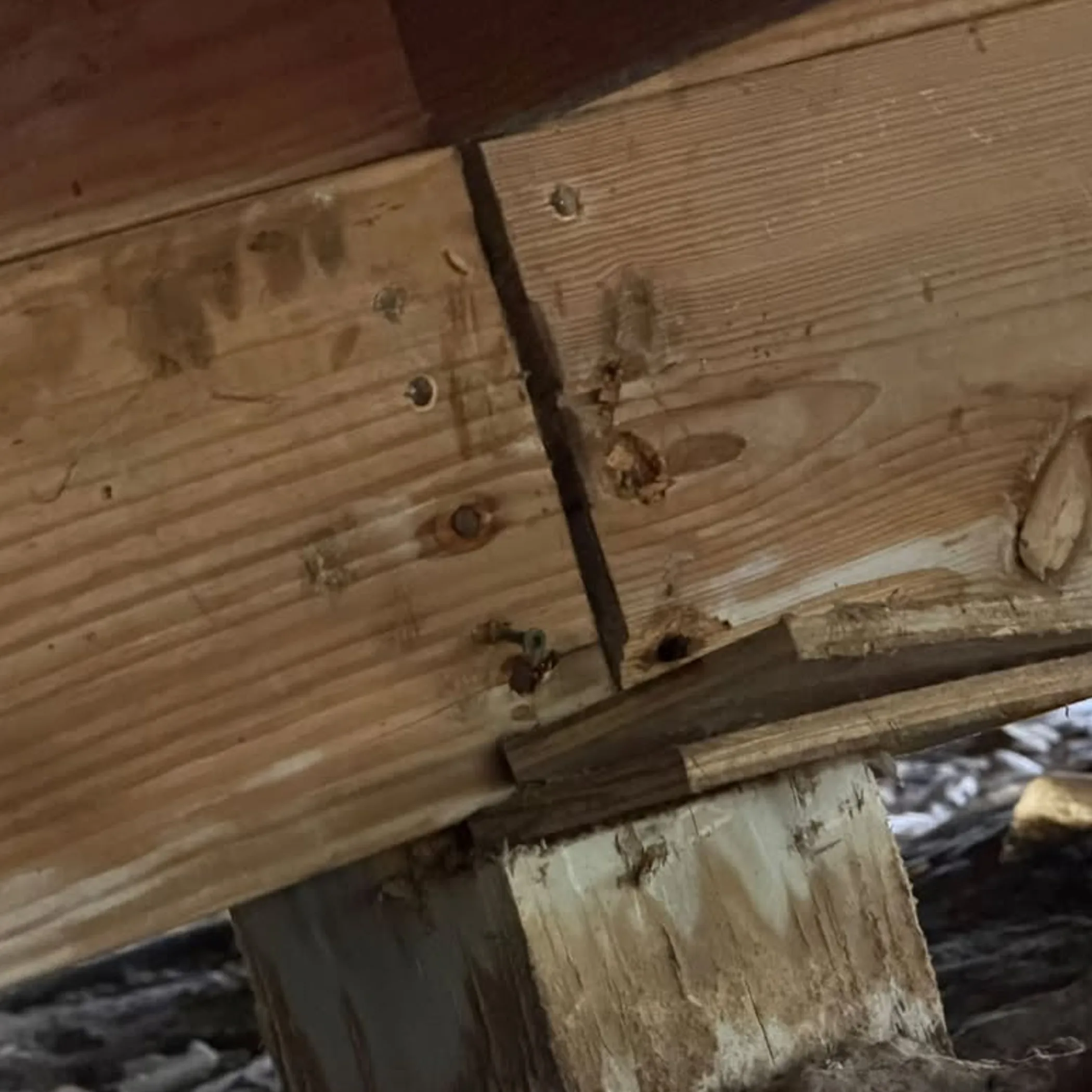 deteriorated wood post shims and beam connection